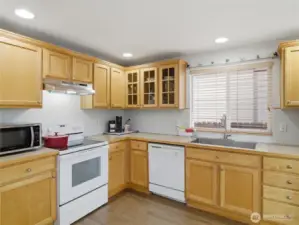 Kitchen has plenty of counter space and deep single bowl sink