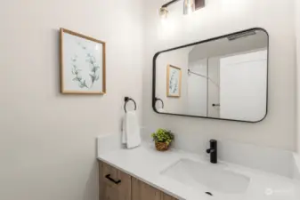 Simple yet sophisticated, this bathroom is perfect for guests. Enjoy stylish fixtures and a clean design that adds a touch of class.