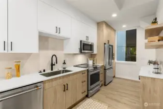 Cook up your favorites in this bright kitchen with premium stainless appliances and sleek cabinetry. Ideal for the chef in you!