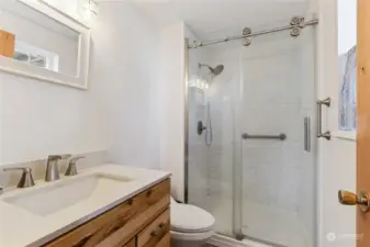 Primary bath with new vanity and new raised toilet.