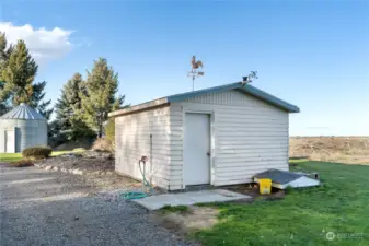 Pump house with storage and one 30 amp RV hookup.