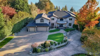 This custom estate offers a front-row seat to panoramic Lake Washington views