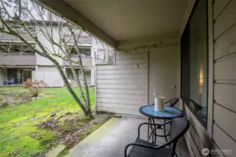 Private and serene back patio space, with storage closet.