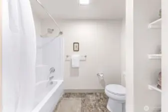 Tub/shower, towel shelves.