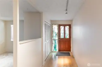 This is a one of a kind artistic feature, custom stained glass door and side window offer privacy and beautiful colored glass detail.  Off to the left, open den or office.  This space could serve many purposes.