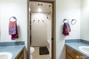 Centrally located on the upper level.  This full bath offers individual sinks and private toilet/bath area.