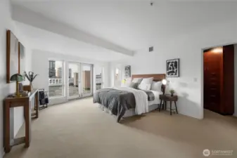 Spacious primary suite with ensuite bathroom and grand walk in closet opens to the terrace.