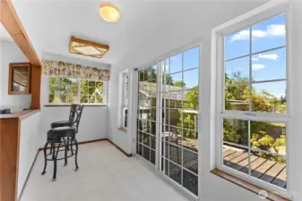 Eating nook with slider to back deck.