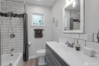 Full Bath With Tile Shower and Quarts Counter Top.