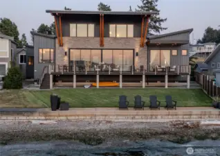 True no-bank waterfront — boat up, tie off, and step directly from the shoreline to your lawn and into the home.