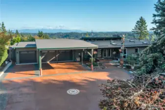 Front view showing RV parking and covered carport. Top quality roof