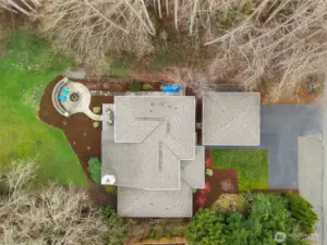 Gorgeous but easy care native landscaping wraps around the property, providing beauty and privacy.