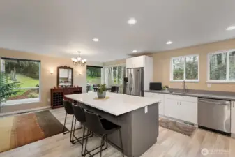There's plenty of elbow room for everyone to hand out in this kitchen. Complementing colors of quartz counters and cabinetry provide style and functionality.