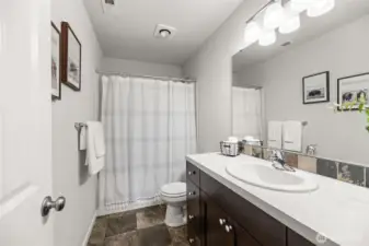 Upstairs shared full bath.