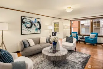 The living room is exceptionally large and can accommodate a second seating area, work from home space, or other creative use.
