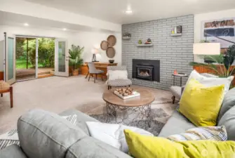 Walkout access to under-deck patio. Wood burning fireplace