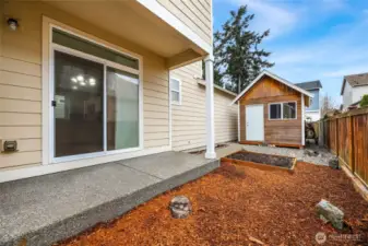 Covered aggregate patio   10’ X 15’ Shed  Planter Box / Faucet in rear yard  RV parking on back side of the house