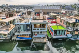 Located on the coveted outside dock with a floating dock off the back—perfect for launching kayaks, paddleboards, or mooring a small boat. Custom racks line the side for your gear, keeping adventure close at hand. Soak in the serenity from your private rooftop deck or unwind as the fully opening Euro-style window invites the sights, sounds, and breeze of Lake Union inside. Here, lakefront living meets urban energy—whether you’re savoring peaceful mornings or catching sunsets with a glass in hand, this floating home is your front-row seat to the Seattle lifestyle.