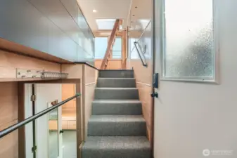 Enter in the mid to lower section of the houseboat with six steps or two steps to the lower level living spaces.