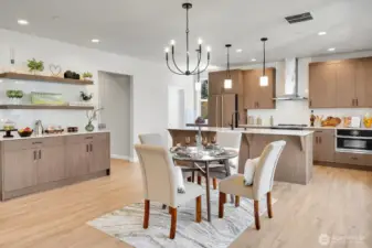 Sleek, modern, and overflowing with storage, the kitchen features stunning slab quartz countertops and backsplash.
