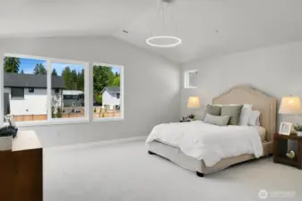 Retreat to the huge, vaulted primary suite, complete with oversized windows and a serene backyard view.