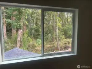 East facing primary bedroom overlooks 25' greenbelt for privacy.