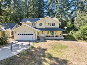 The home has something for everyone! Privacy, over an acre, 2700 sq ft, shop/studio and more.