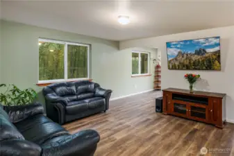 Light & bright living area that sides to the greenbelt.