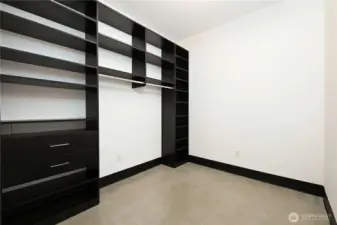 Primary bedroom walk-in closet