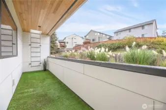 Covered balcony and roof access for rooftop deck