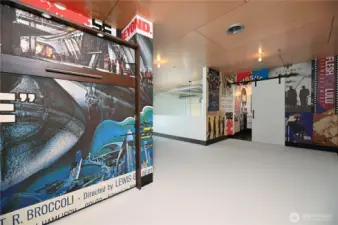 Open room with hide-away bed and 3/4 bathroom entry