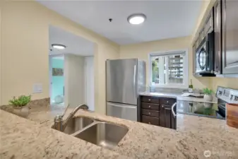 Bright kitchen and Grant counter tops all stainless steel appliances stay