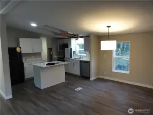 Open concept for living room, dining area and kitchen.