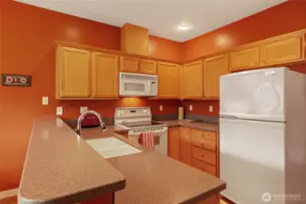 All white-on-white appliances included! Range, Refrigerator, Dishwasher & Microwave!