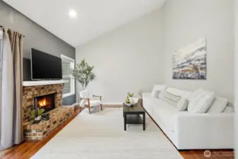 great vibes in this space with the vaulted ceilings, also note there is no popcorn ceiling in this unit, it has all been removed which also brightens up the space