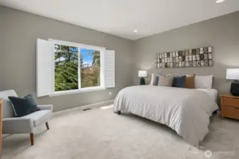 Spacious main-floor primary bedroom.