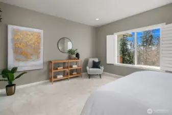 Spacious main-floor primary bedroom.