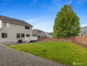 Owners had extensive landscaping done including grass, watering features, garden beds, and retaining walls.