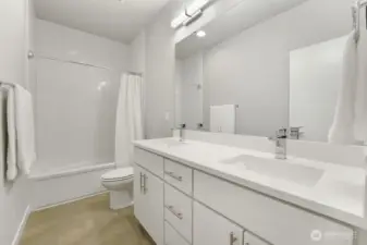Top-floor  Bathroom with Double Sinks and Tub
