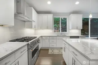 Kitchen with Large Island and KitchenAid Red Medallion Series Appliances