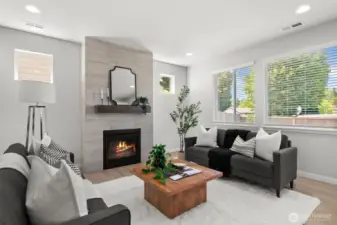 Well placed windows, including transom windows maximize natural light for a bright and cheerful living space.