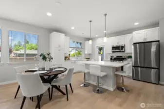 The open-concept layout is both spacious and functional, enhanced by 9-foot ceilings and well-placed windows that fill the room with natural light, creating an even greater sense of space.