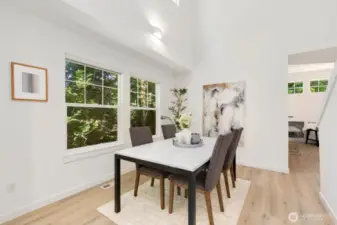Dining room feels open & bright with vaulted ceilings