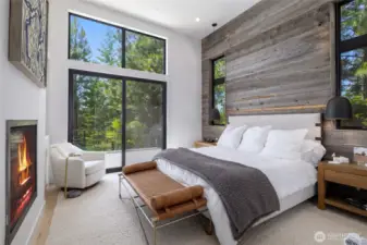 Primary on main floor w/old barnwood accent wall.