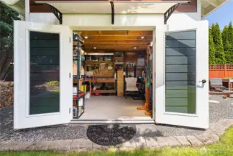 Shop includes attic storage, can lights and heat.