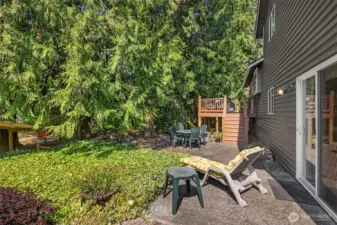 Just outside the office/rec room, enjoy your sunny backyard patio and so much space to garden!