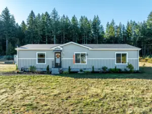 This beautifully maintained 1,492 sq ft, 3 bed / 2 bath home offers welcoming curb appeal and sits on a spacious 1.44-acre lot, blending modern style with rural tranquility.