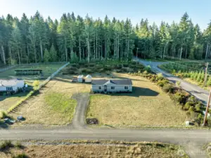 Ample parking and a gravel driveway leading directly to the home.