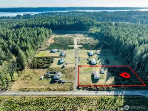 Spacious lot with plenty of open yard and easy access from a quiet rural road.