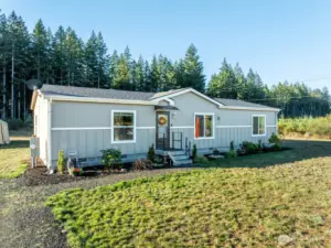 The clean lines and fresh landscaping of this 3 bed, 2 bath home make a lasting first impression, with 1,492 sq ft of living space set against the backdrop of 1.44 private acres.